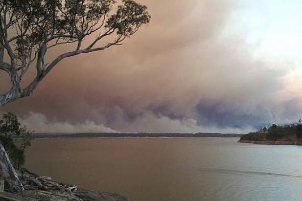 A bushfire burns towards the Glenmaggie Caravan Park.