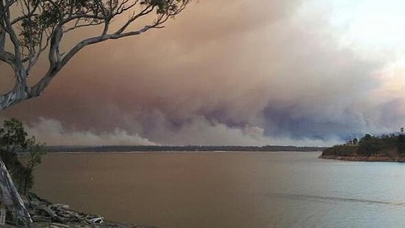A bushfire burns towards the Glenmaggie Caravan Park.