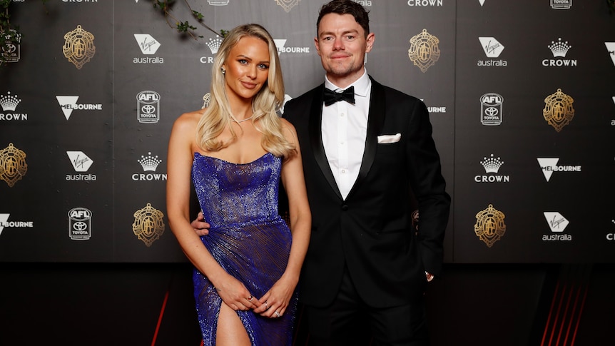Lachie Neale and Julie Neale pose on the red carpet at the Brownlow Medal