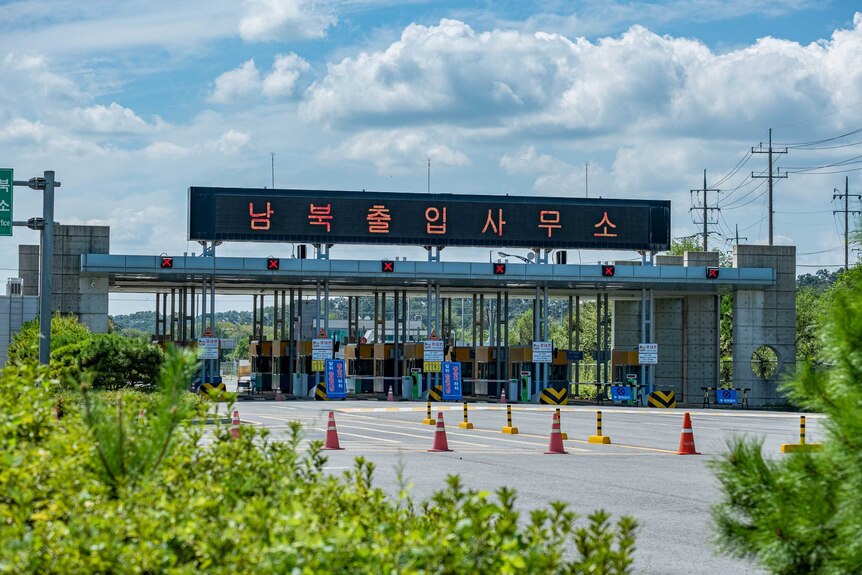 A freeway with manual tolls at the entrance of the DMZ in South Korea.