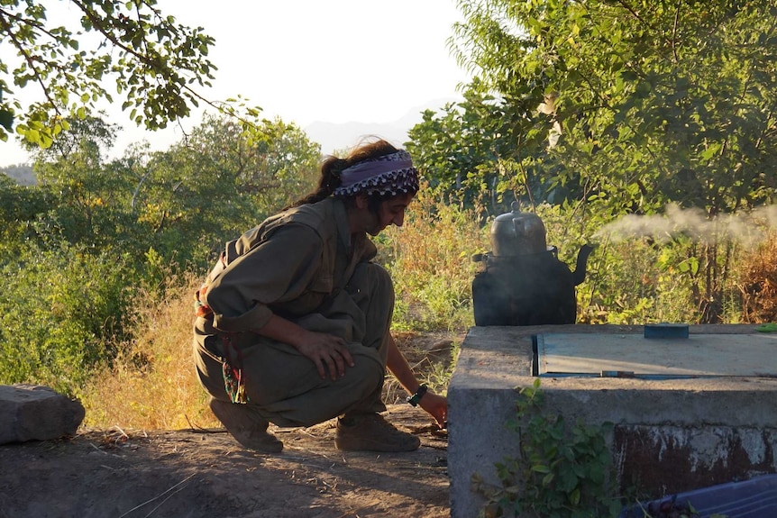 A 16-year-old fighter prepares tea