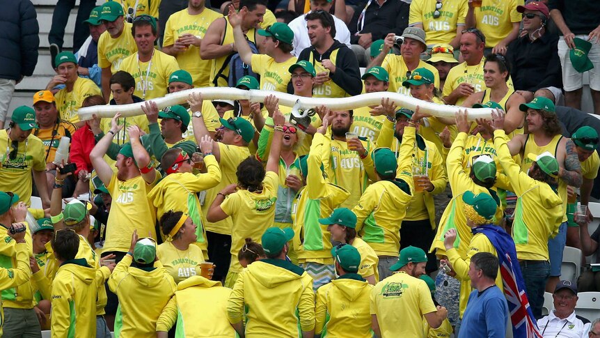 Australia fans build a beer snake during day one of the Ashes
