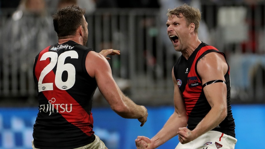 Jake Stringer yells in the face of Essendon Bombers teammate Cale Hooker during an AFL win over West Coast Eagles.