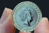 A coin depicting the new coinage portrait of Her Majesty Queen Elizabeth II