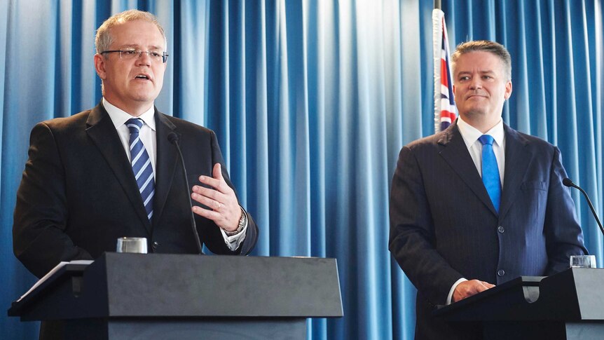 Treasurer Scott Morrison (left) and Finance Minister Mathias Cormann address the media after handing down the 2015-16 MYEFO.