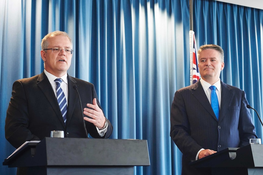 Treasurer Scott Morrison (left) and Finance Minister Mathias Cormann address the media after handing down the 2015-16 MYEFO.