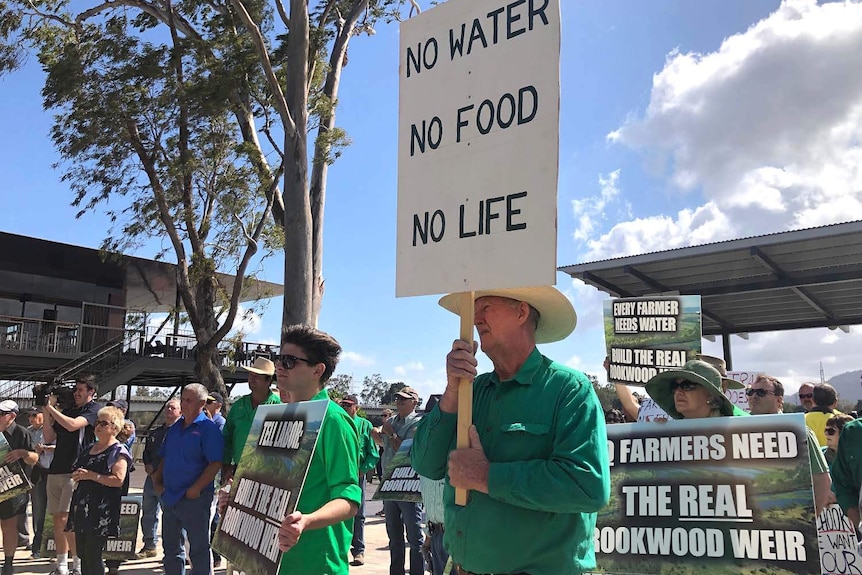 Men and women holding placards at a protest