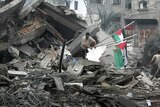 Palestinians inspect the destroyed office building of Hamas prime minister Ismail Haniya