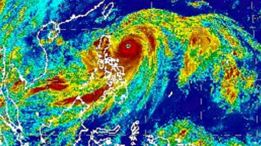 A false-colour satellite image of Typhoon Manghkut approaching the northern Philippines island of Luzon