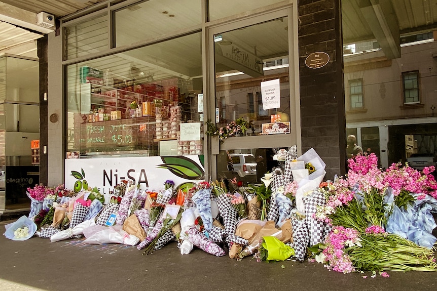 Bouquets outside a deli in Richmond.