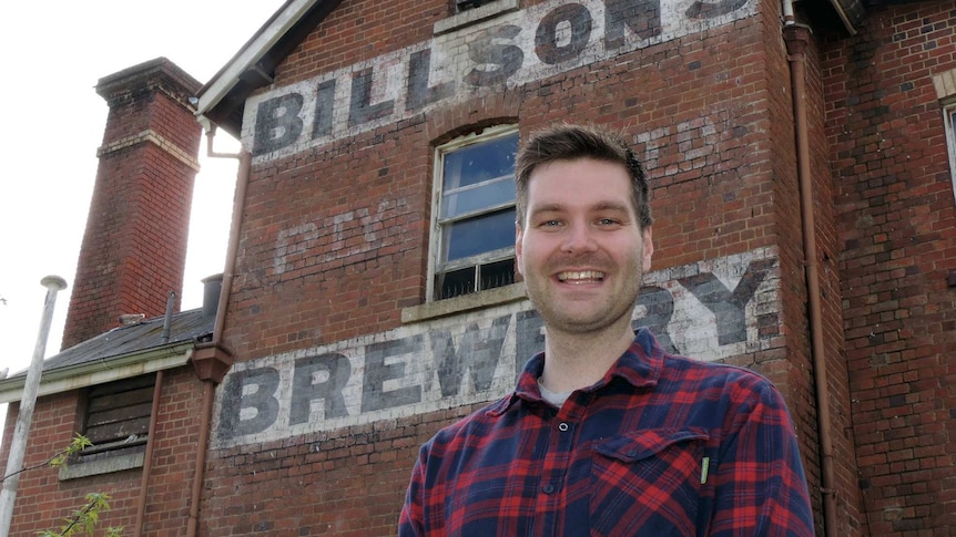 Nathan Cowan standing in front of Billson's Brewery