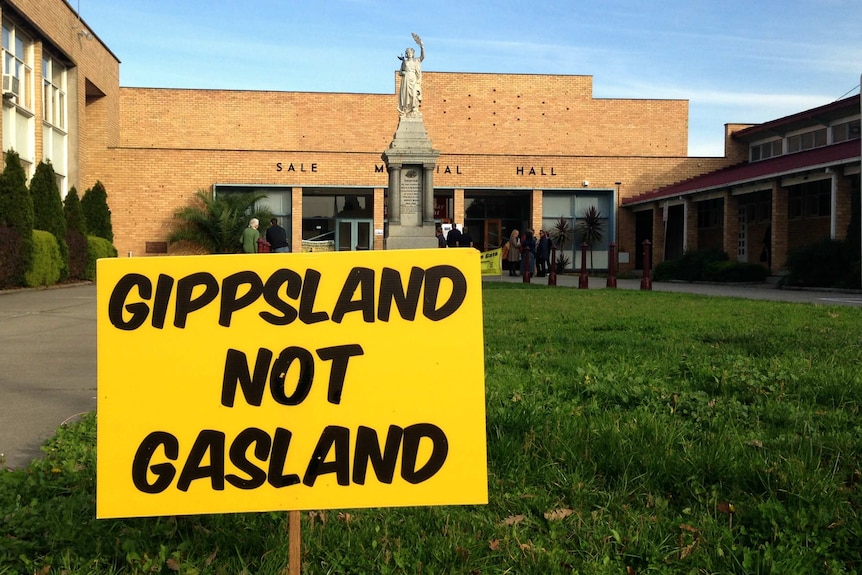 A sign reads 'GIPPSLAND NOT GASLAND', in protest of gas exploration.