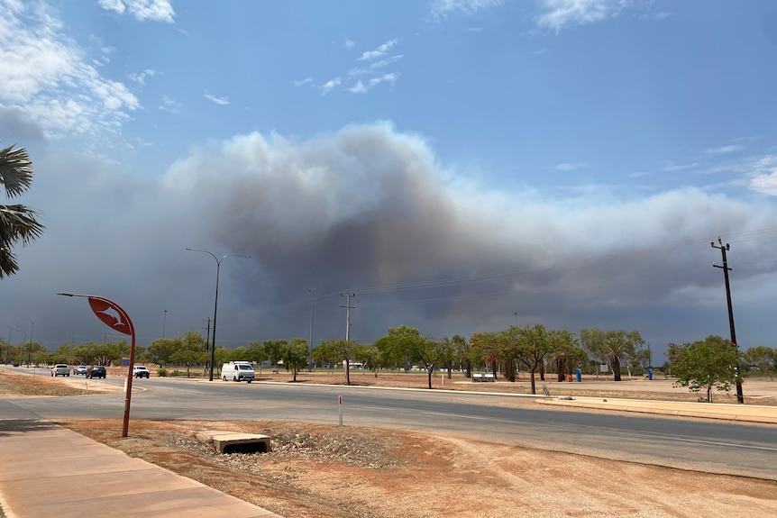 Smoke visible from town as fires bracket Exmouth in Western Australia.