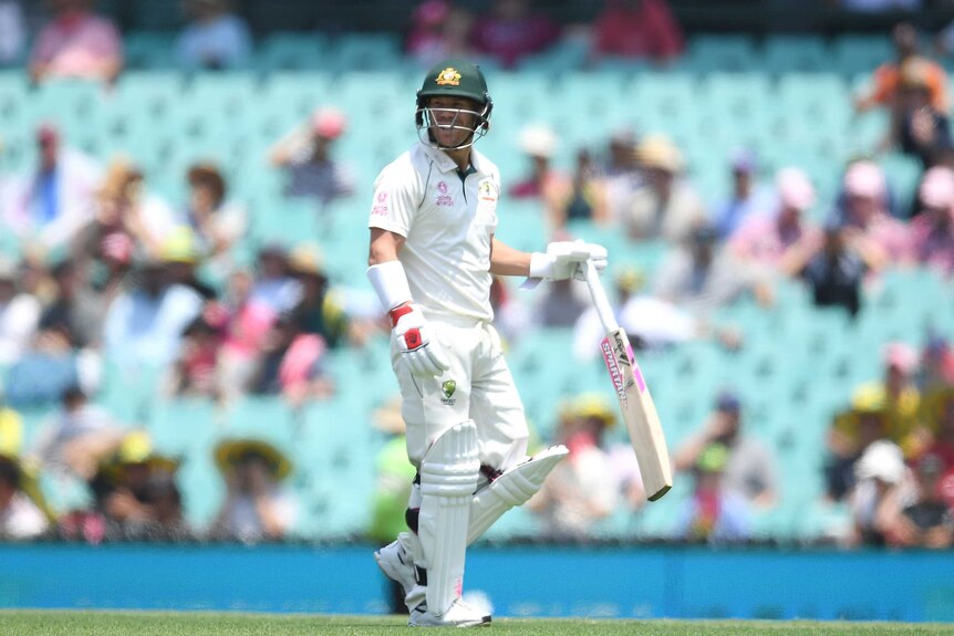 An Australian batsman walks of the SCG after being dismissed by New Zealand.