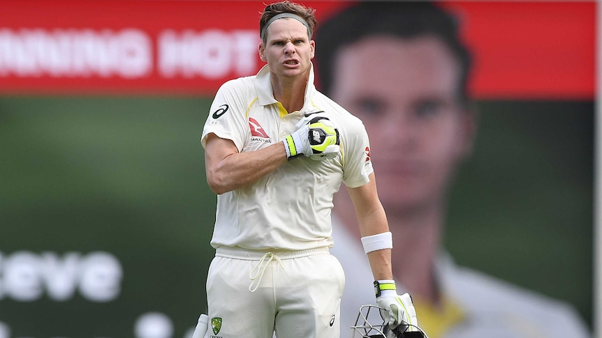 Australian captain Steve Smith reacts after scoring a century against England at the Gabba.