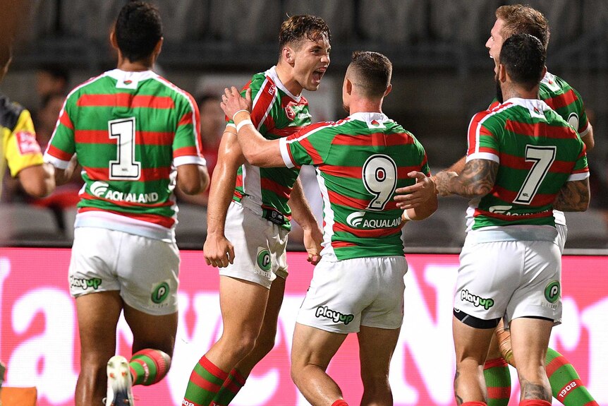 Five Souths players converge to congratulate a smiling Cameron Murray.