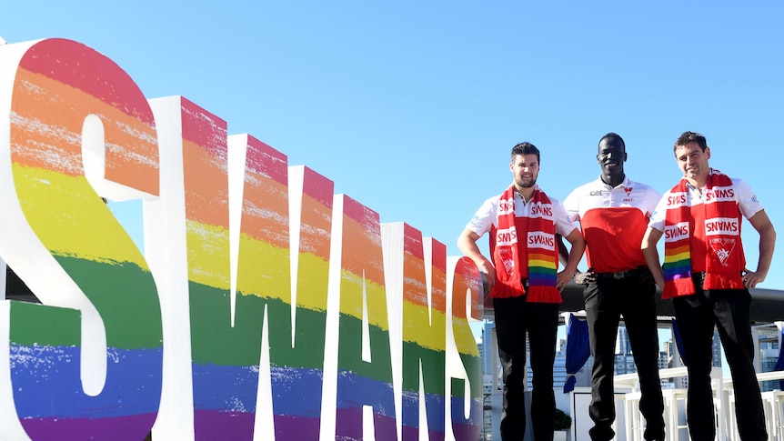 Sydney Swans AFL players Nic Newman, Aliir Aliir and Nick Smith pose for a photograph ahead of the AFL pride match.