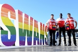 Sydney Swans AFL players Nic Newman, Aliir Aliir and Nick Smith pose for a photograph ahead of the AFL pride match.