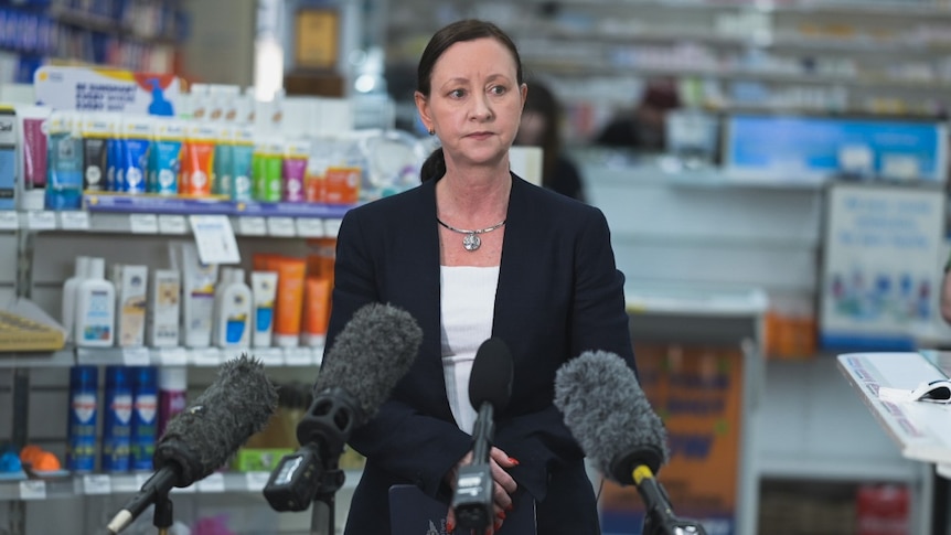 Yvette D'Ath gives a press conference in a pharmacy