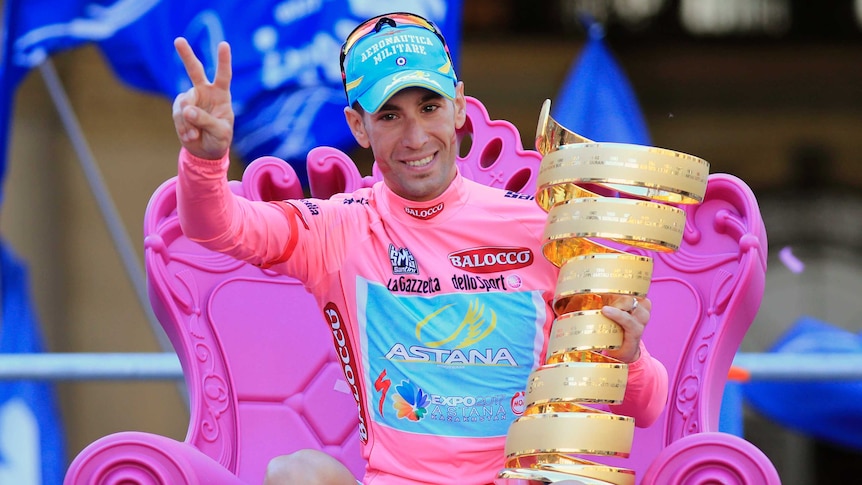 Italy's Vincenzo Nibali holds the Giro D'Italia trophy after winning the 2013 race in Brescia.