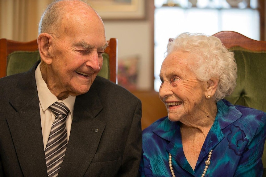 George and Iris Barlin stare into each other's eyes.