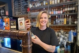 woman pouring a glass of beer