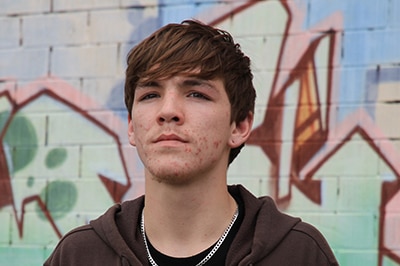 Young man wearing a hoodie.