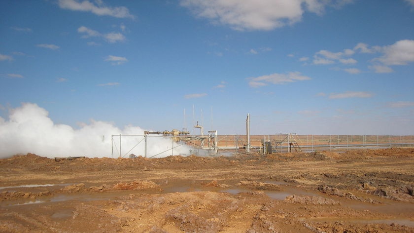 steam rises from geothermal well