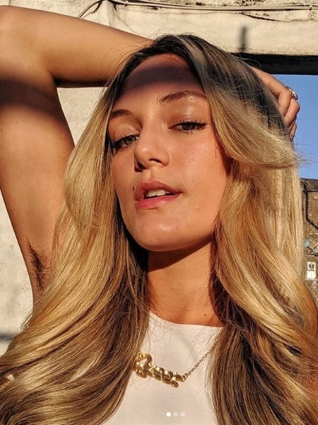 Florence Given displaying her armpit hair on Instagram
