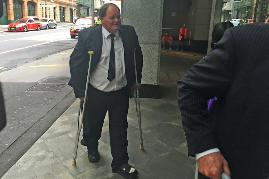 Former Botany Council Chief Financial Officer Gary Goodman arriving on crutches at the ICAC.
