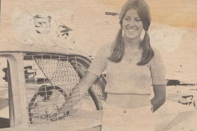 Kathy Moore standing near car cropped