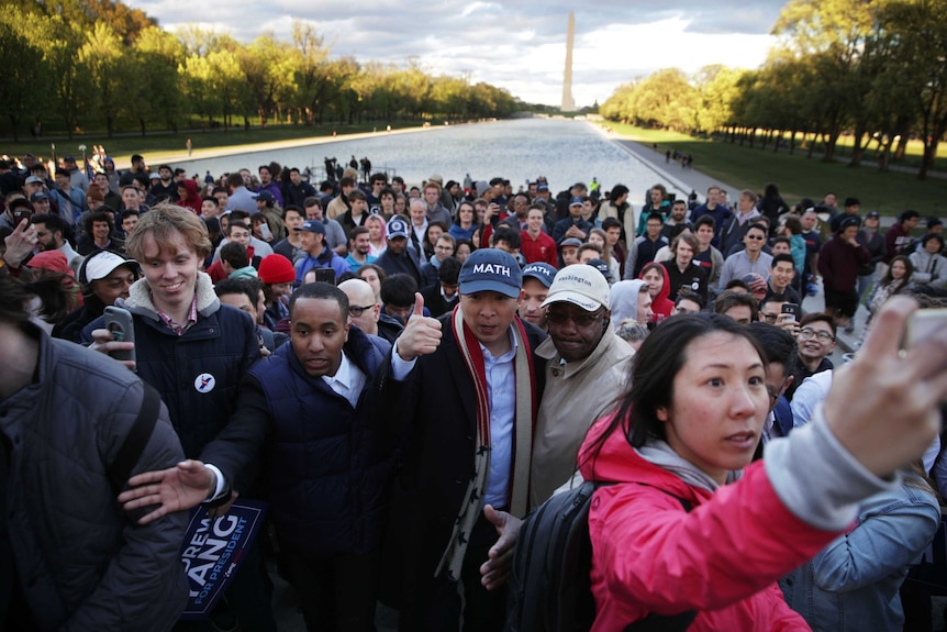Andrew Yang leaves after a campaign rally at the Lincoln Memorial