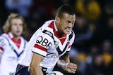 Sydney Roosters prop Kane Evans charges against the Warriors