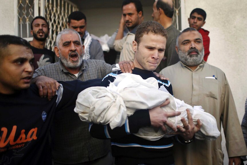 BBC journalist carries his son's body