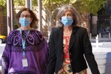 Nicola Spurrier walking into court wearing a face mask