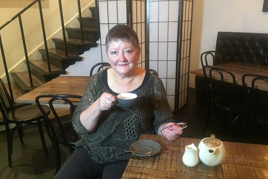 Anne MacBean of Melbourne holding a teacup.