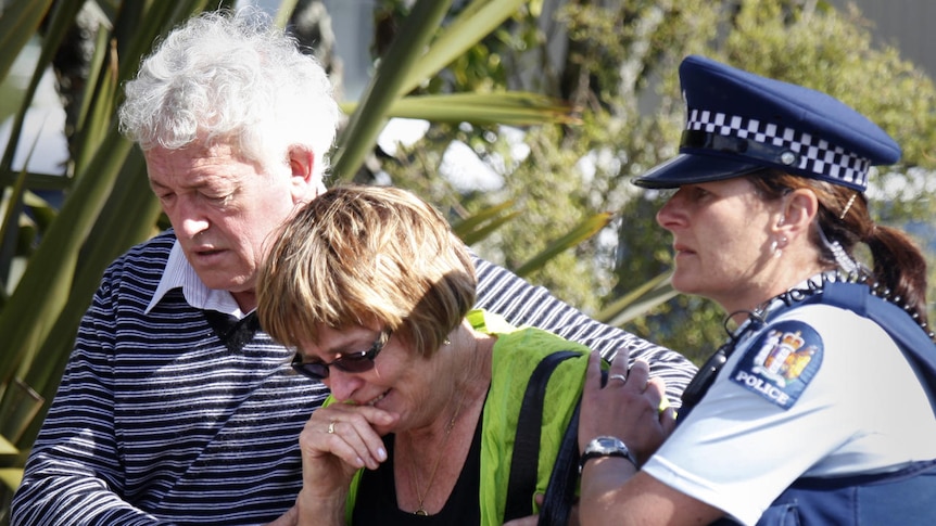 Family members are supported by police after learning of the second explosion.