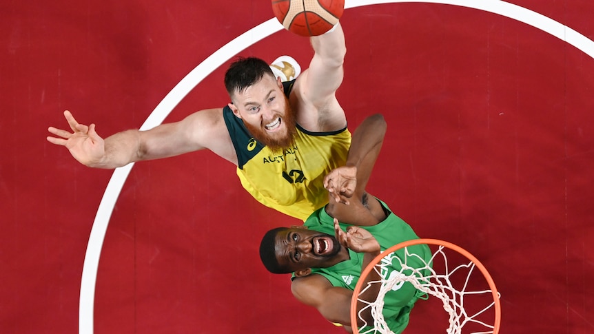 Australia's Aron Baynes shoots over Nigeria's Ekpe Udoh at the Tokyo Olympics.