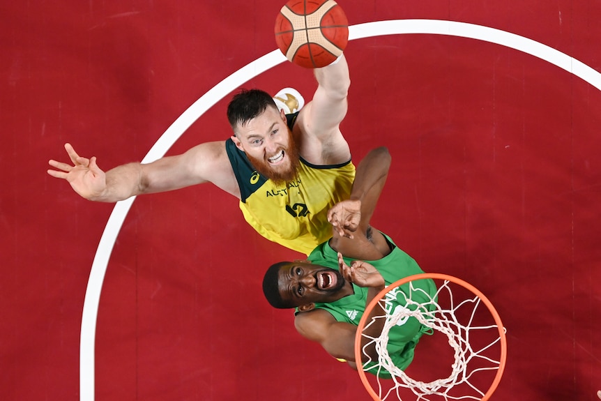 Australia's Aron Baynes shoots over Nigeria's Ekpe Udoh at the Tokyo Olympics.