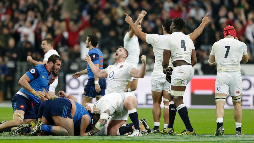 England's George Kruis and team-mates celebrate the grand slam after Six Nations win over France.
