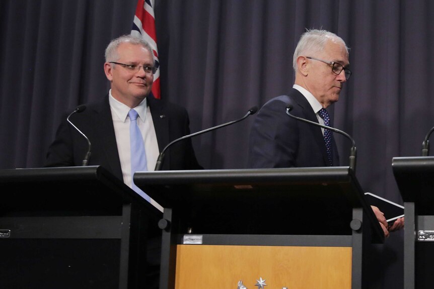 Morrison is all smiles and Turnbull the opposite as they walk out.