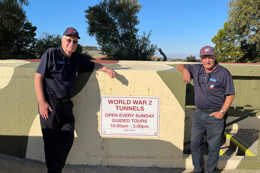 Standing proudly outside a camouflaged bunker entrance Peter Kerr and David Carter of the RAAHS WA