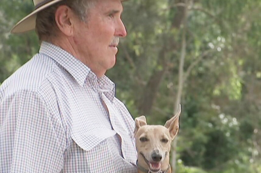69-year-old Brisbane retiree Greg Rogers with his dog Fudgie