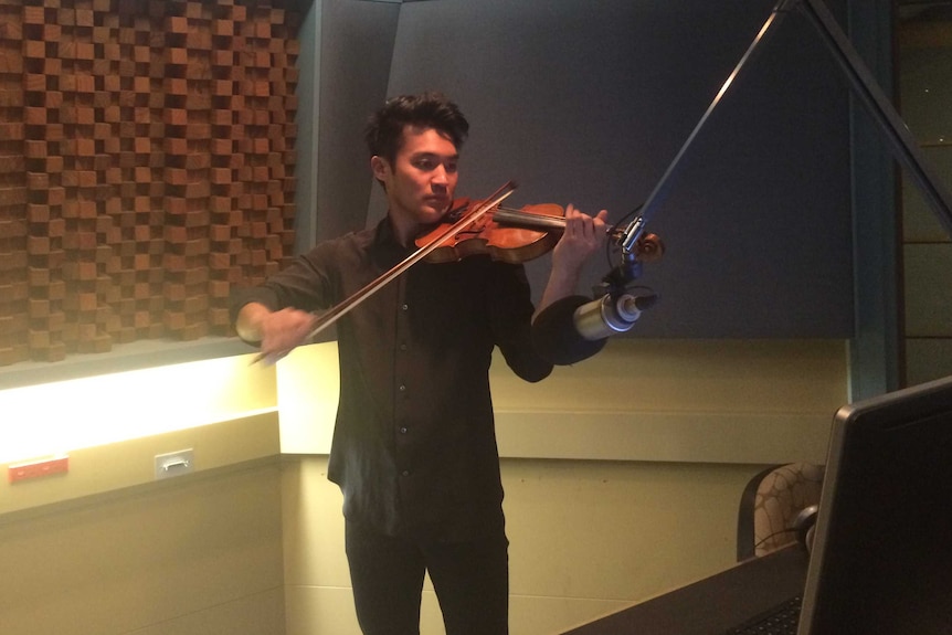 Ray Chen playing the violin in the studio