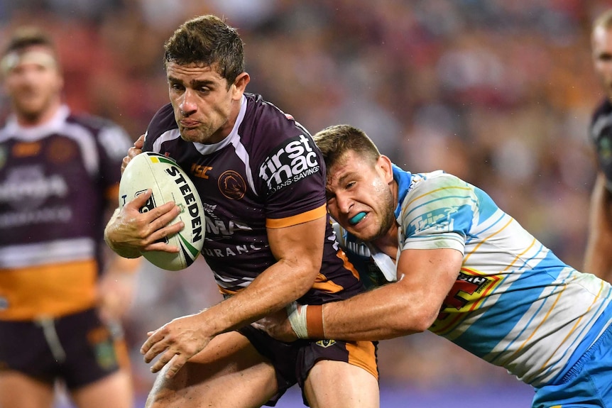 Andrew McCullough playing for the Broncos against the Titans.