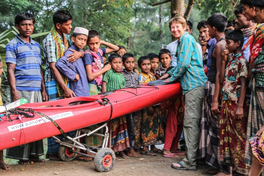 Showing the kayak to people in Bangladesh