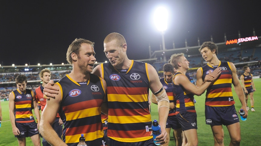 Sam Jacobs (foreground, right) has extended his deal with the Crows until the end of 2016.