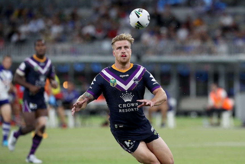 Cameron Munster prepares to catch the ball for the Storm against the Bulldogs
