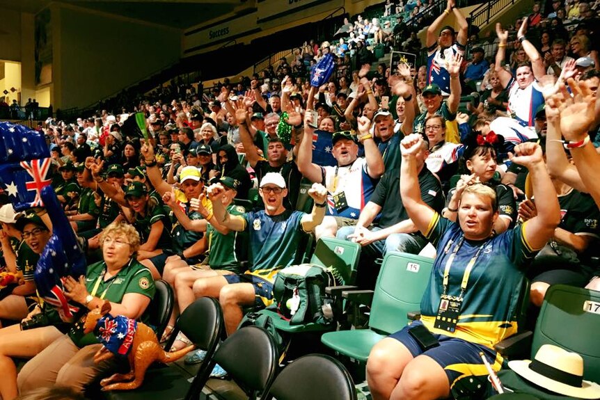Supporters cheer on the Australian team