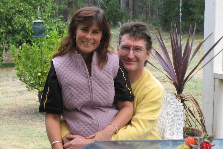 Joanne Duncan sitting on her husband, Stephen Myall's lap.